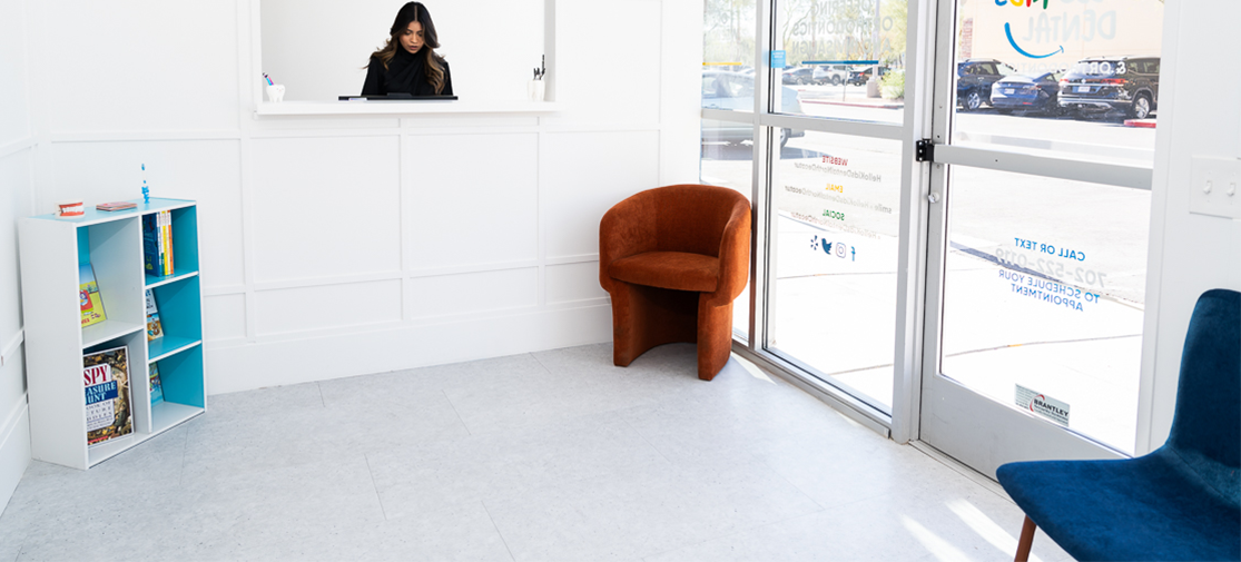 Dentist receptionist smiling standing